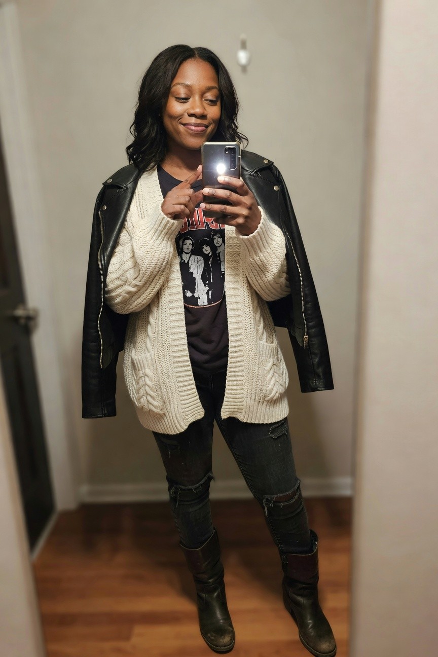 Leather Jacket Layered Over A Knit Cardigan