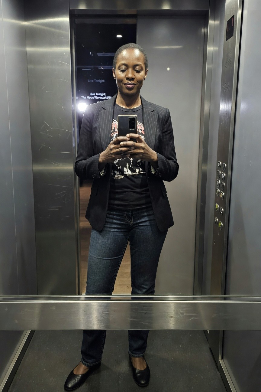 Pinstripe Blazer Over Graphic Tee And Jeans