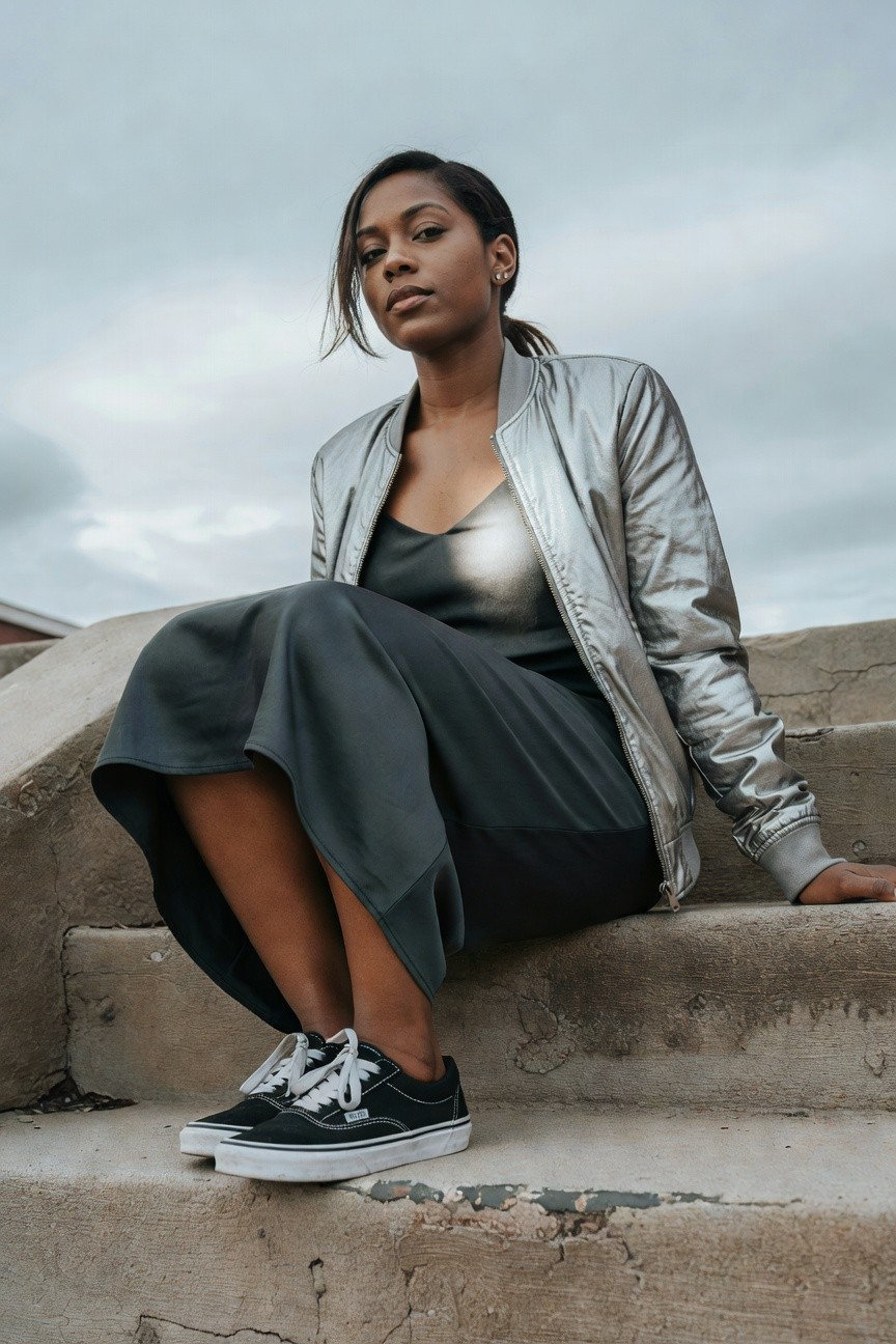 Metallic Bomber Over A Dark Midi Skirt